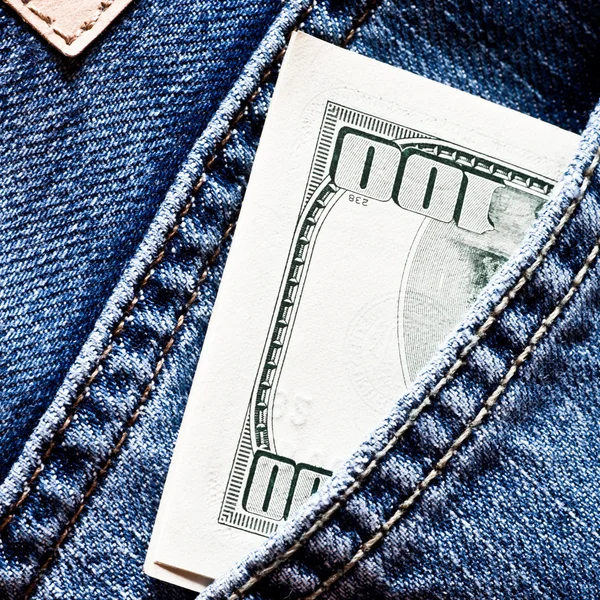 Jeans pocket with dollars banknotes — Stock Photo, Image