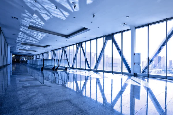 Glass corridor with escalator — Stock Photo, Image