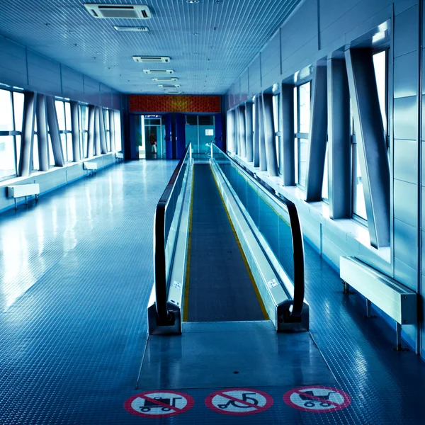 Empty blue escalator — Stock Photo, Image