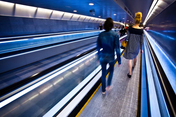 Blue moving escalator with — Stock Photo, Image