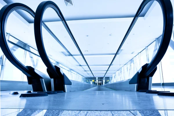 Empty blue escalator — Stock Photo, Image