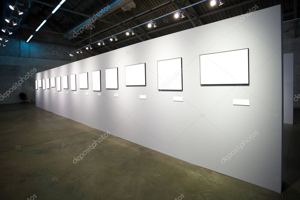 White wall with many empty frames