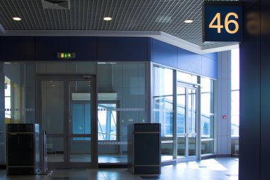 Blue gate 46 in airport terminal, Moscow clipart