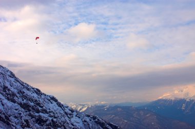 Paraglide in mountains clipart