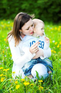 Baby boy with mother play clipart