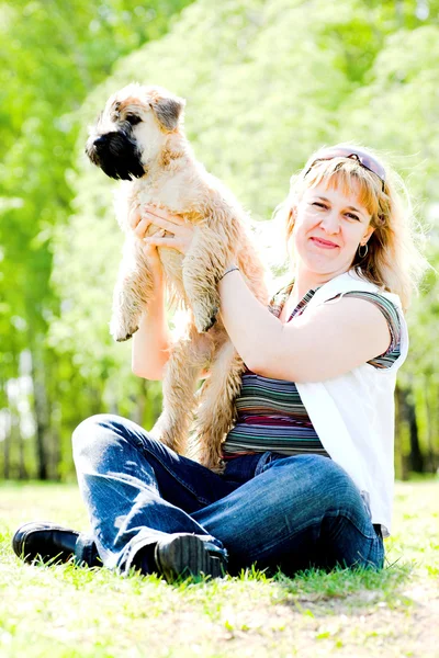 Terrier dog and woman — Stock Photo, Image