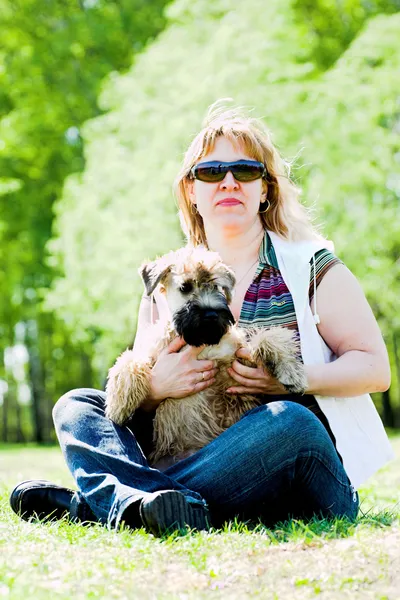 Terrier dog and woman — Stock Photo, Image