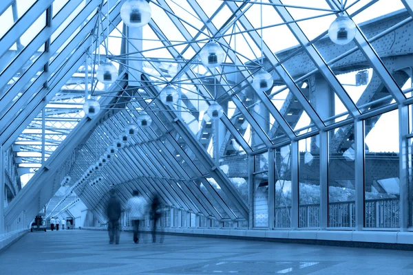 Blue glass corridor in bridge — Stock Photo, Image