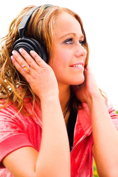 Smiling girl in headphones — Stock Photo, Image