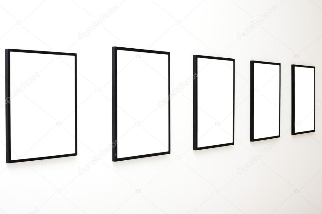Five empty frames on white wall