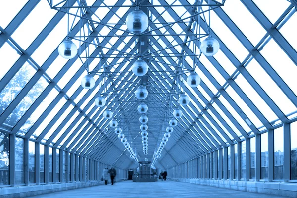 Blue glass corridor in bridge — Stock Photo, Image