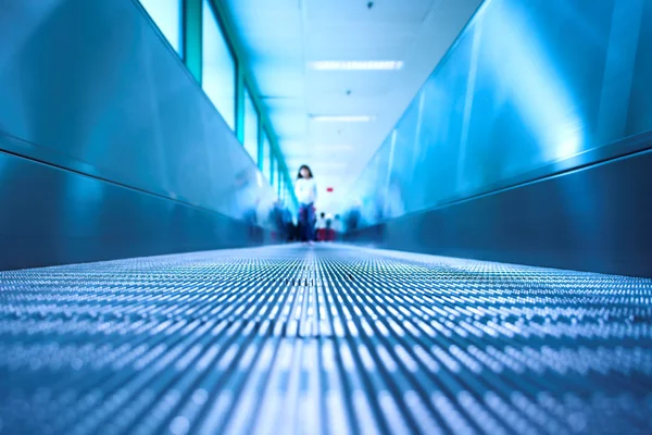Blue moving escalator in the office hall — Stock Photo, Image
