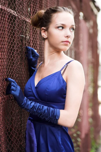 Beautiful girl in blue with gloves — Stock Photo, Image