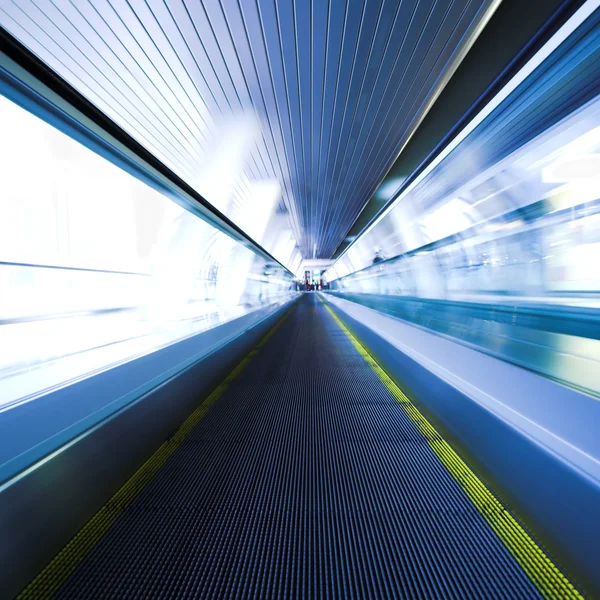 Blue moving escalator in the office hall — Stock Photo, Image