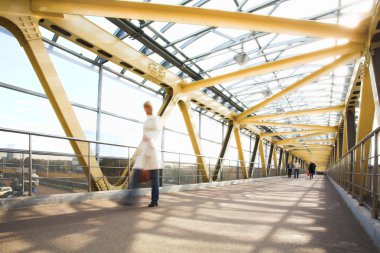 Yellow metal corridor, crowd mooving clipart