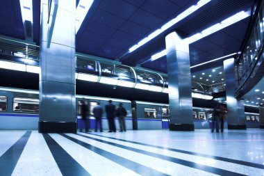 Blue fast train at platform clipart