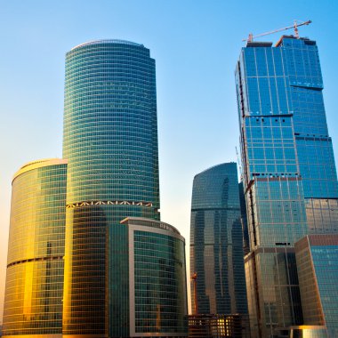 New skyscrapers at evening clipart