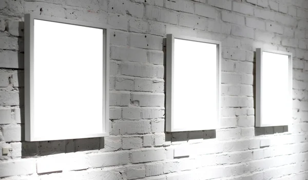 Three frames on white wall — Stock Photo, Image