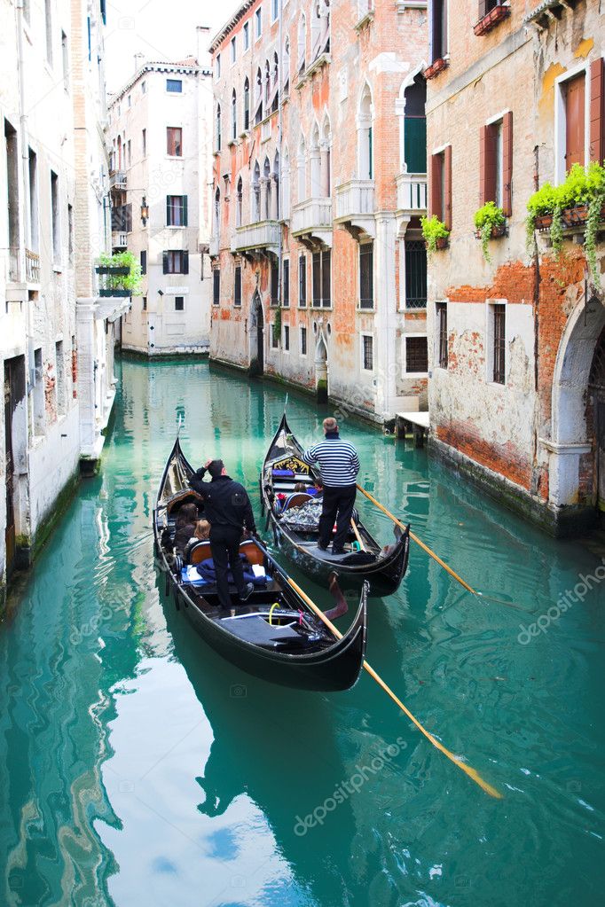 Gondoliers on water