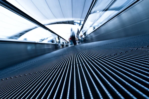 Moving blue travolator in airport — Stock Photo, Image