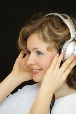 The young girl with headphones clipart