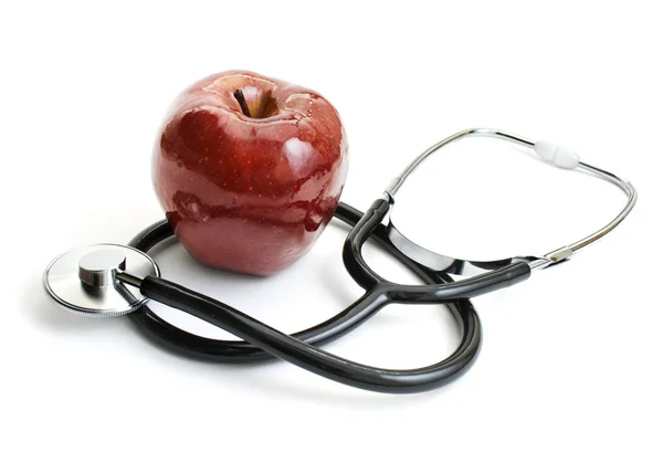 Jabłko i stetoskop — Zdjęcie stockowe