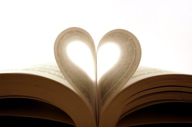 Pages of a book curved into a heart shap clipart