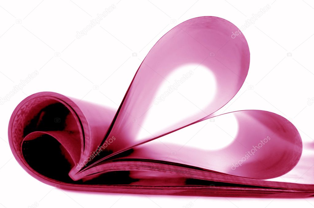 Pages of magazine curved into a heart sh