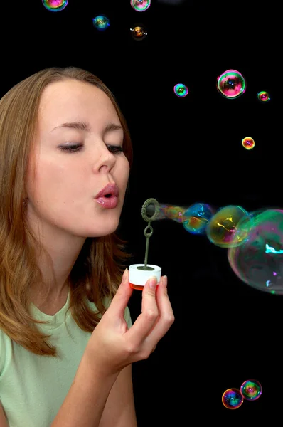 Girl playing with lots of soap bubbles — Stock Photo, Image