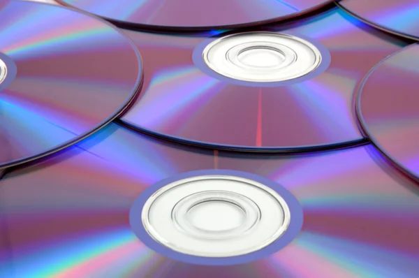Néhány színes CD háttere — Stock Fotó