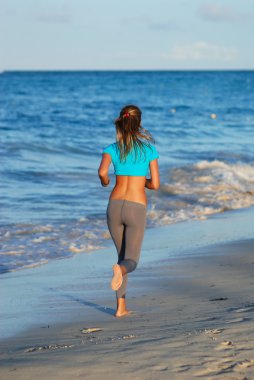 Jogging at beach clipart