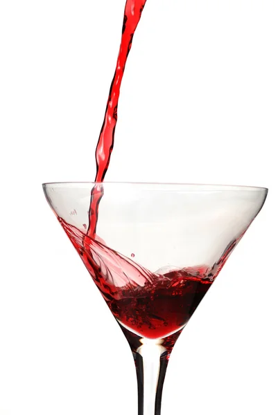Ποτήρι κόκκινο κρασί και τα Χριστούγεννα παιχνίδ ロイヤリティフリーのストック画像