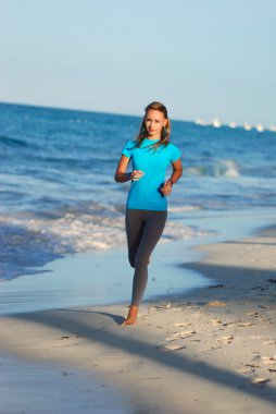 Jogging at beach clipart