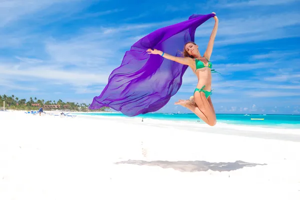 Jump with sarong — Stock Photo, Image