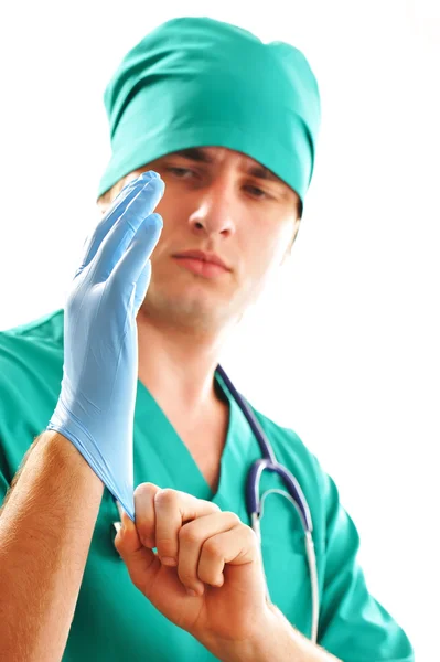 Pulling on surgical glove — Zdjęcie stockowe