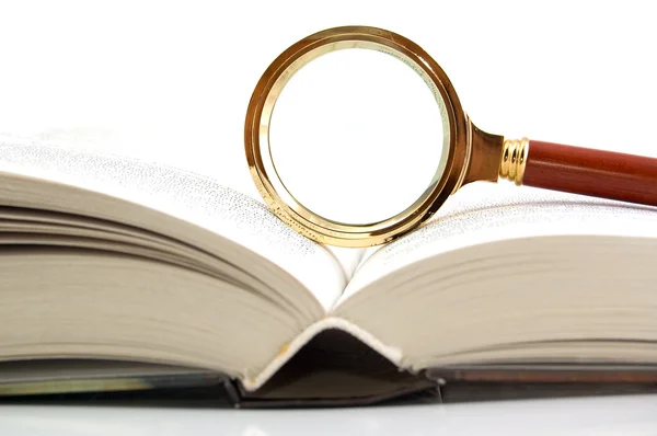 Magnifier and the book — Stock Photo, Image