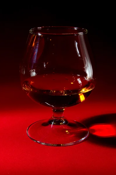 Cognac on a red — Stock Photo, Image