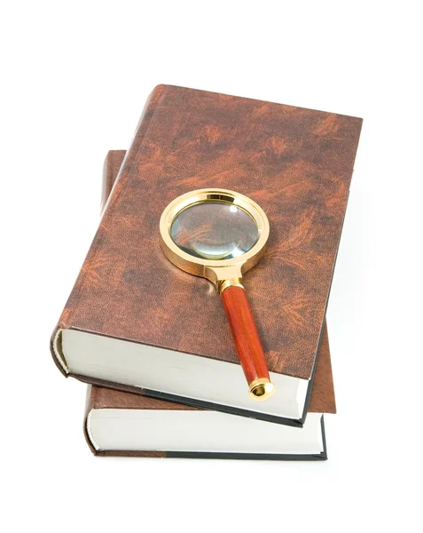 Magnifying glass on books. — Stock Photo, Image