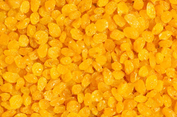 Background made of yellow dried raisins — Stock Photo, Image