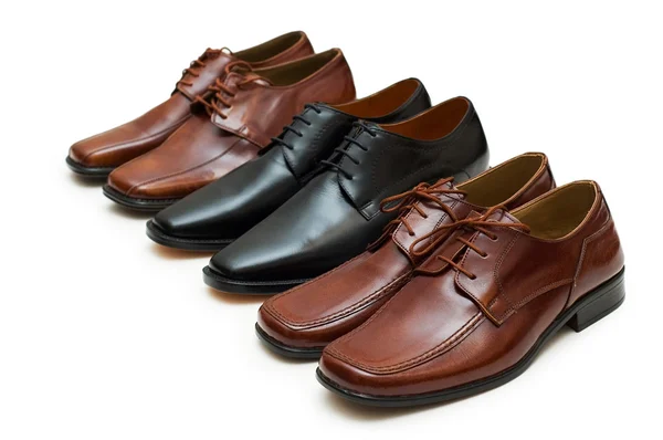 Varie scarpe maschili isolate sul bianco Immagini Stock Royalty Free