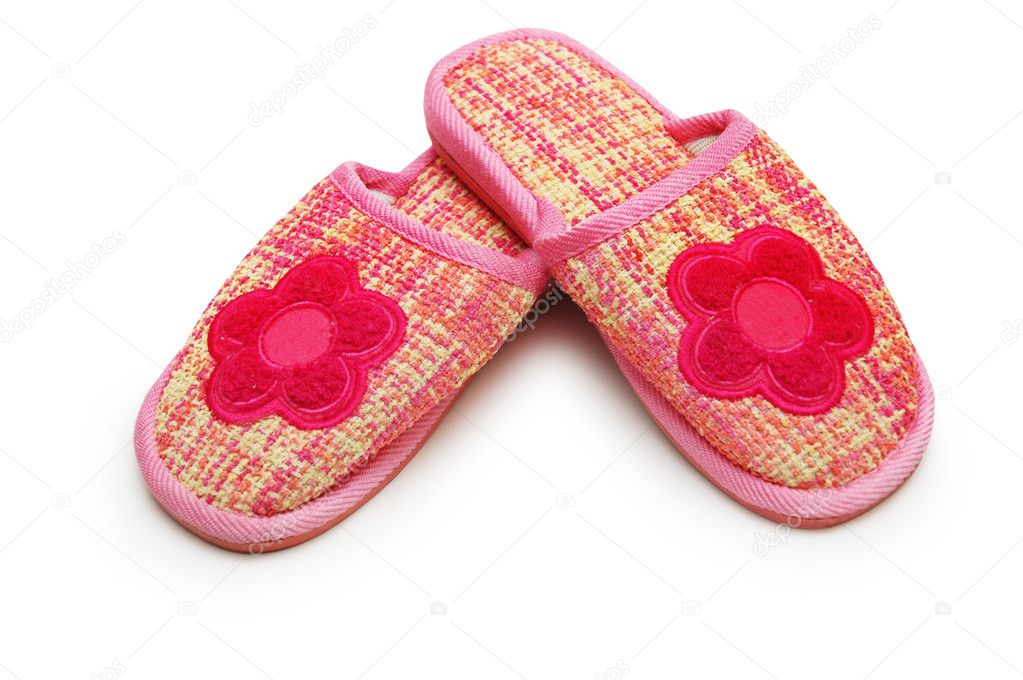 Pair of pink slippers isolated on white