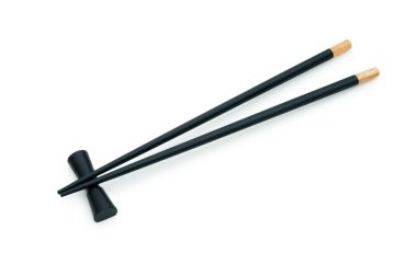 Black chopsticks isolated on the white clipart