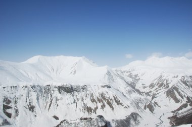 High mountains under snow in the winter clipart