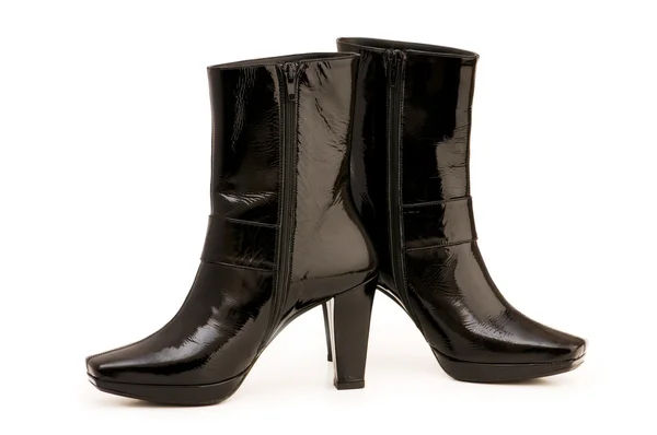 Zwarte laarzen geïsoleerd op de witte — Stockfoto