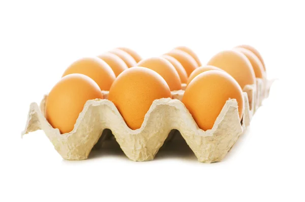 Fazla yumurta üzerinde beyaz izole — Stok fotoğraf