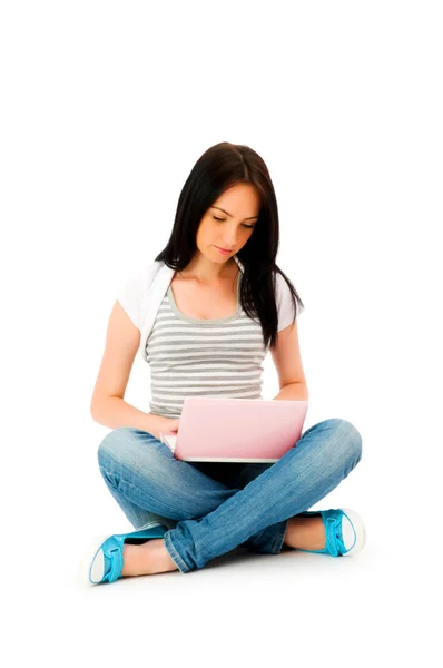 Girl working on laptop isolated on white — Stock Photo, Image