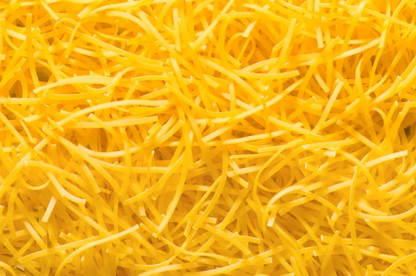 Extreme close up of yellow italian pasta — Stock Photo, Image