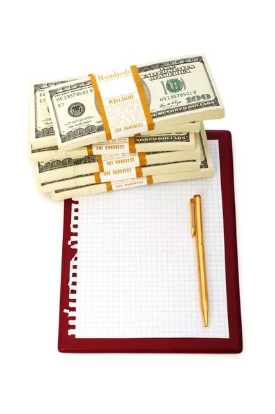 Pilha de dólares e almofada em branco — Fotografia de Stock