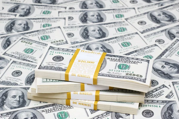 Stack dollar på pengar — Stockfoto