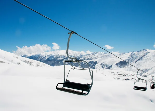 Ski lift chairs on bright day — Stock Photo, Image